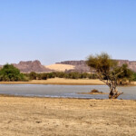 Riki and lake near village